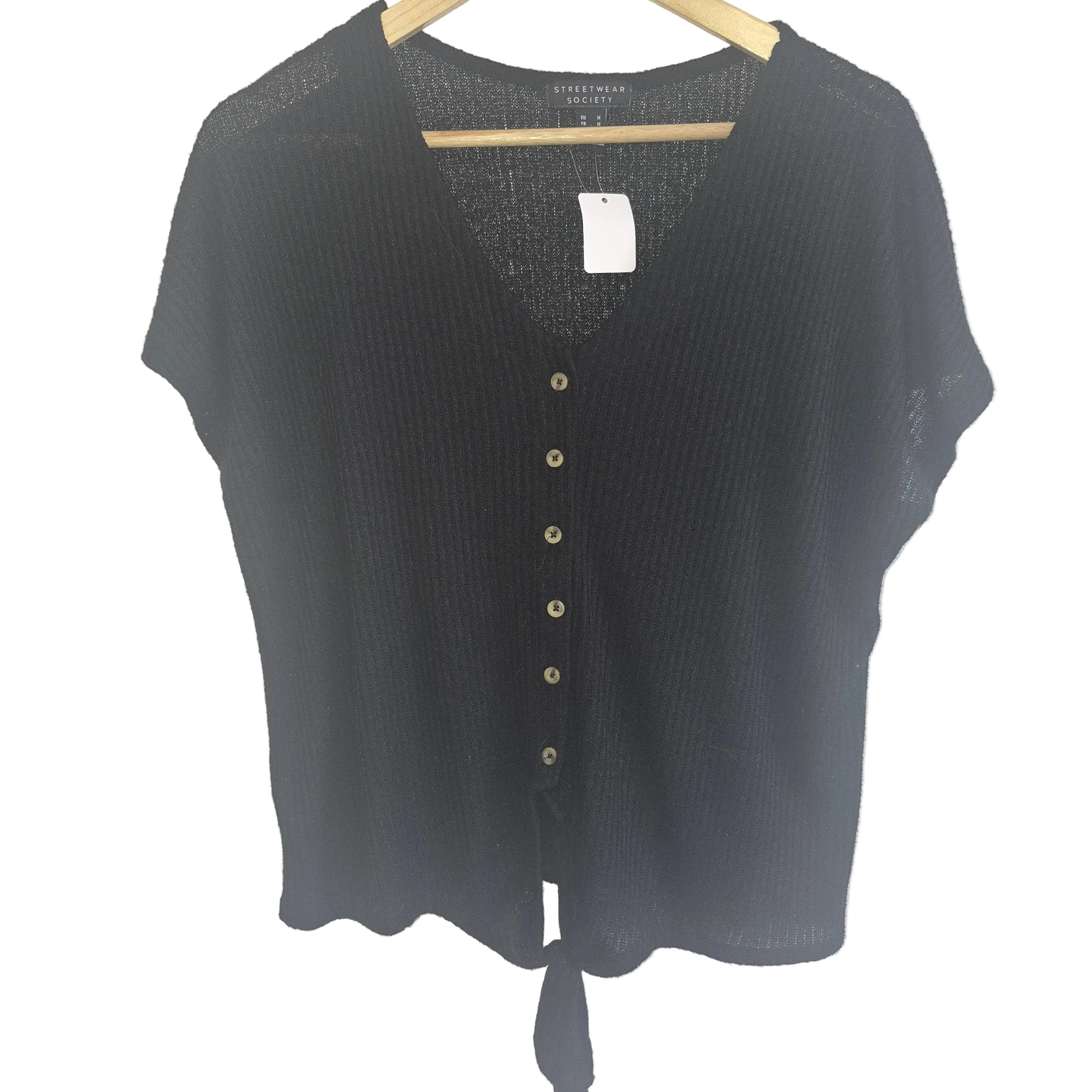 Black short-sleeve cardigan on a hanger against a white background